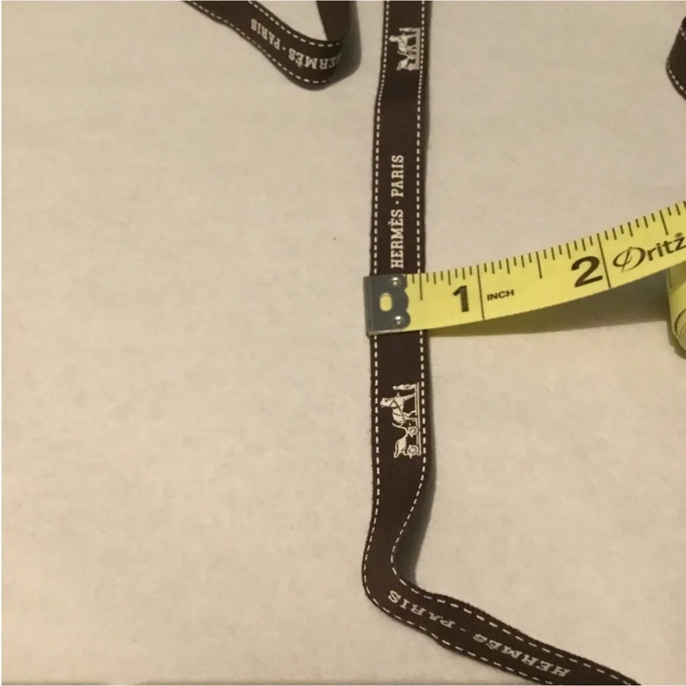 HERMES 70”L BRWON RIBBON 1/2”W LIGHT CREAM LOGO PRINTED WRINKLE FOLD MARKS